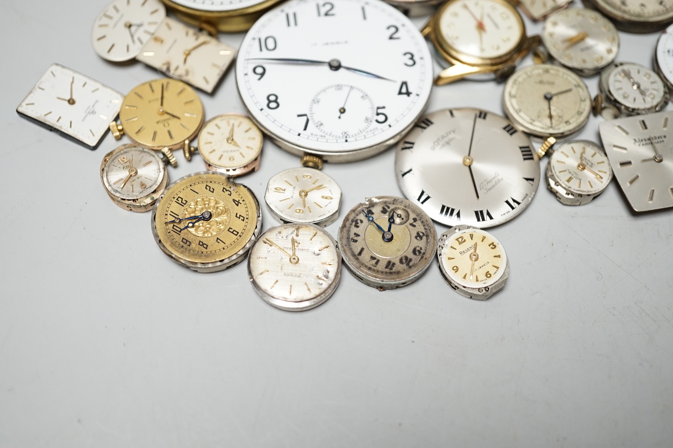 A collection of assorted wrist and pocket watch parts.